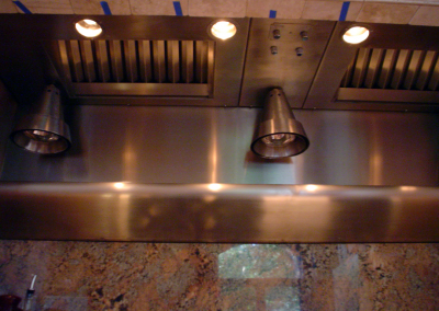 Custom stainless steel insert with hanging heat lamps.