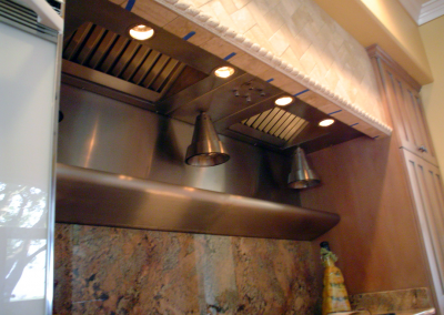 Custom stainless steel insert with hanging heat lamps.