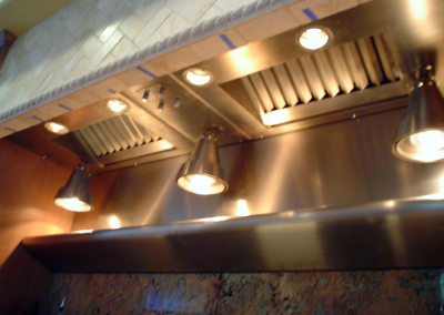 Custom stainless steel insert with hanging heat lamps.