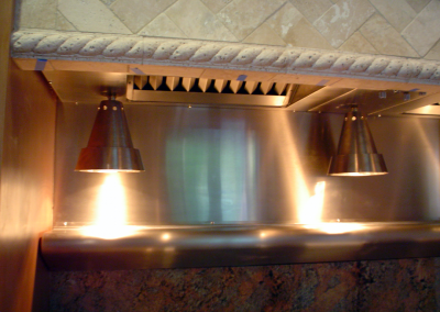 Custom stainless steel insert with hanging heat lamps.